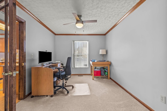 carpeted home office featuring ornamental molding, a textured ceiling, and ceiling fan