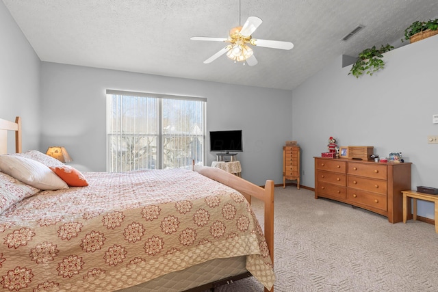 bedroom with ceiling fan, light colored carpet, vaulted ceiling, and a textured ceiling