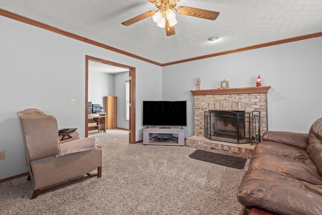 carpeted living room featuring a textured ceiling, ceiling fan, ornamental molding, and a fireplace