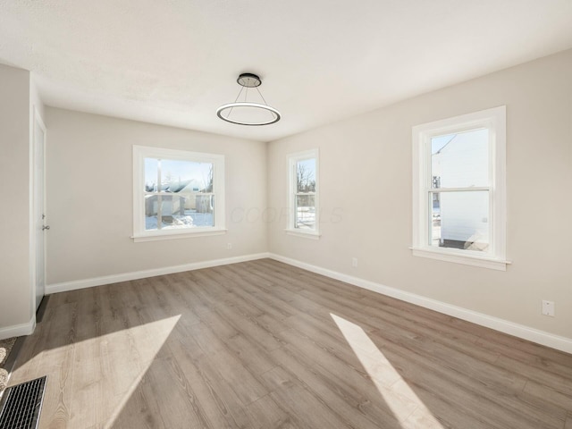 unfurnished dining area featuring light hardwood / wood-style flooring