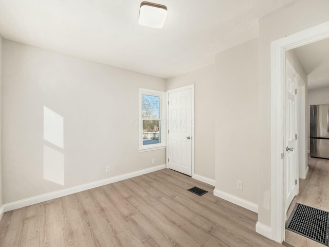 empty room featuring light hardwood / wood-style flooring