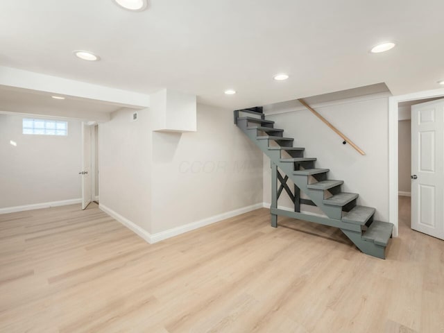 basement featuring light hardwood / wood-style flooring