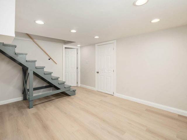 basement featuring light hardwood / wood-style flooring