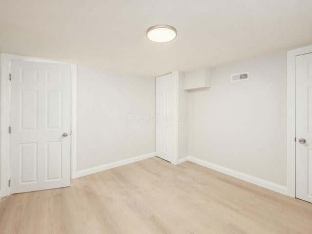 empty room with light wood-type flooring