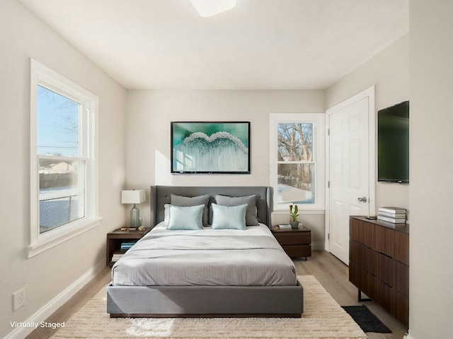 bedroom with light hardwood / wood-style floors