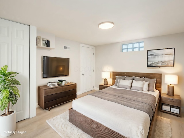 bedroom featuring light hardwood / wood-style flooring