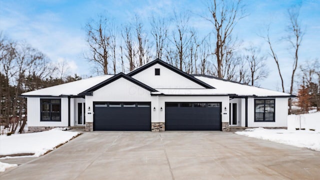 modern farmhouse featuring a garage