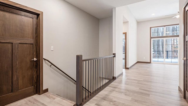 corridor with light wood-type flooring