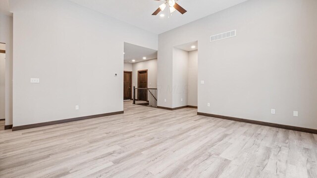 unfurnished room featuring ceiling fan and light wood-type flooring