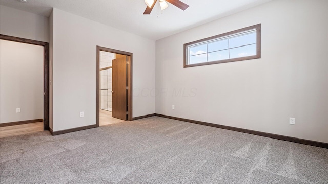 unfurnished bedroom featuring ceiling fan and light colored carpet