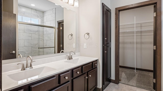 bathroom with walk in shower and vanity