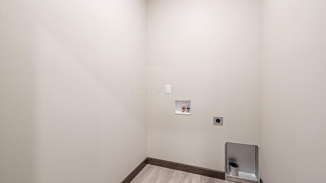 washroom with washer hookup, hardwood / wood-style floors, and hookup for an electric dryer