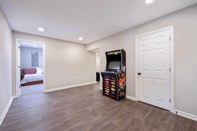 interior space featuring electric panel and dark hardwood / wood-style floors