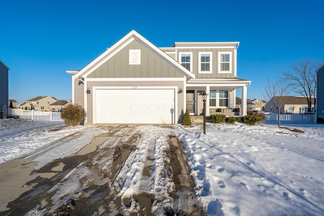 view of front of home featuring covered porch and a garage