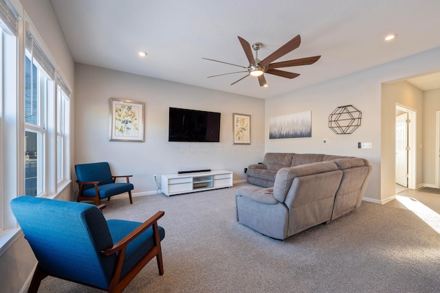 living room with ceiling fan and carpet floors