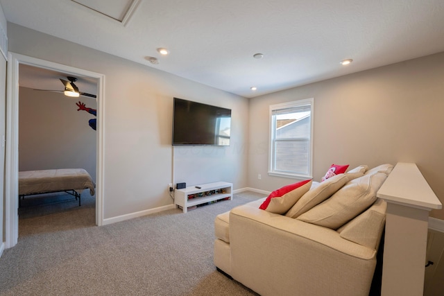 carpeted living room featuring ceiling fan