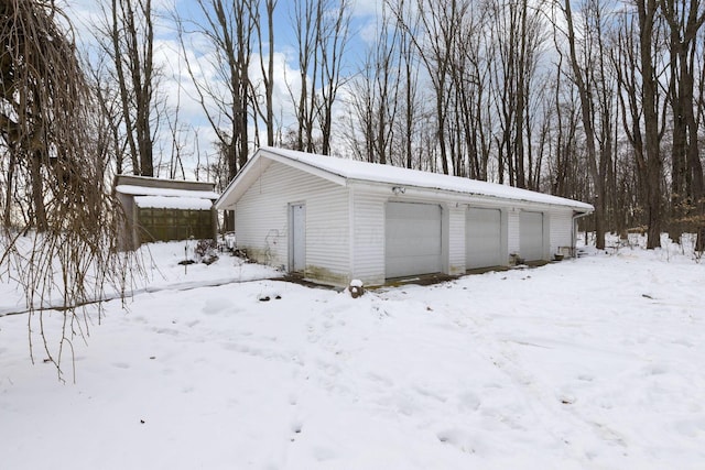 view of snow covered garage