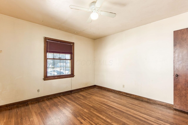 unfurnished room featuring ceiling fan and dark hardwood / wood-style floors