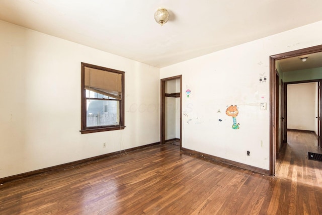 empty room featuring dark hardwood / wood-style floors