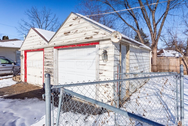 view of snow covered garage