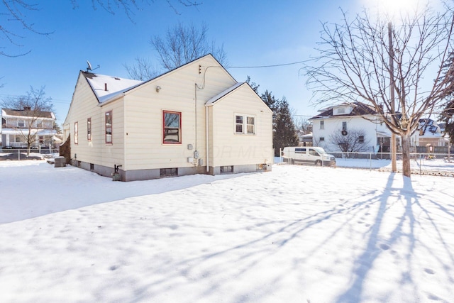 view of snow covered house