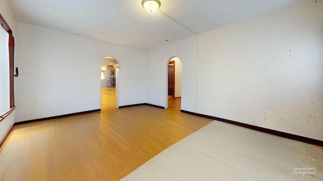 unfurnished room featuring hardwood / wood-style floors