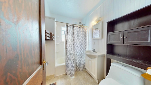 full bath featuring toilet, shower / bathtub combination with curtain, vanity, and tile patterned floors