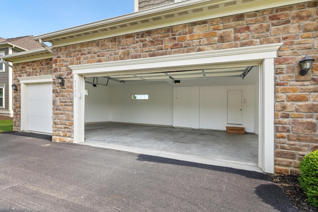 7136 Cabernet Ct, Dublin, OH 43016 - garage featuring asphalt driveway