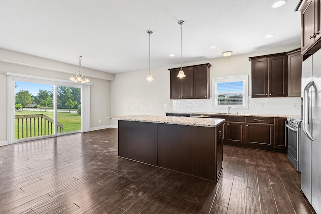 7136 Cabernet Ct, Dublin, OH 43016 - kitchen with stainless steel appliances, dark brown cabinets, backsplash, plenty of natural light, and recessed lighting