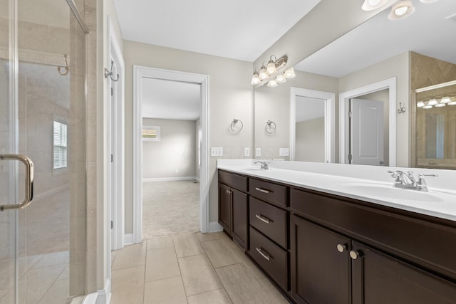 7136 Cabernet Ct, Dublin, OH 43016 - bathroom featuring double vanity, a stall shower, and tile patterned floors