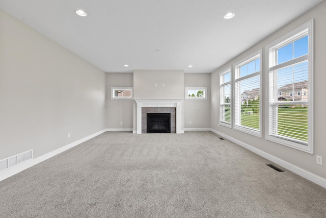 7136 Cabernet Ct, Dublin, OH 43016 - unfurnished living room featuring carpet flooring, recessed lighting, and a tiled fireplace