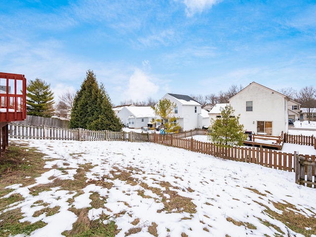 view of yard layered in snow