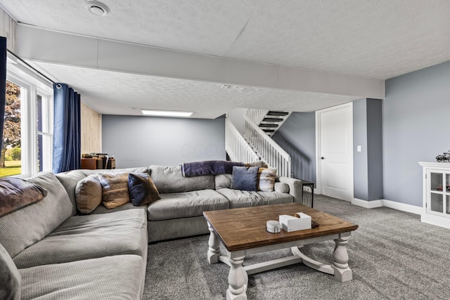 carpeted living room with a textured ceiling