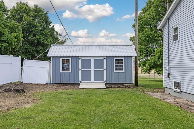 view of outdoor structure with a lawn