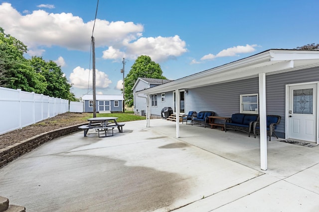 view of patio featuring an outbuilding