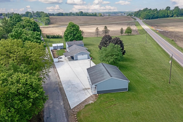 birds eye view of property with a rural view