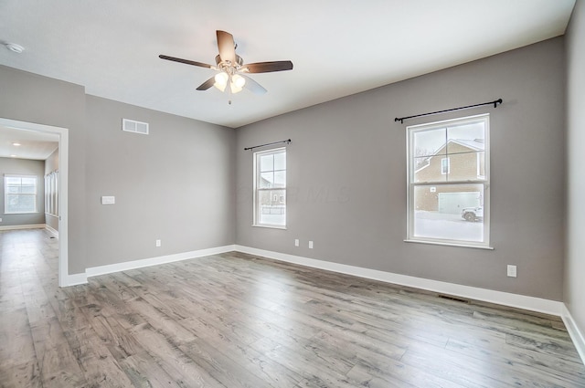 unfurnished room featuring ceiling fan and light hardwood / wood-style flooring