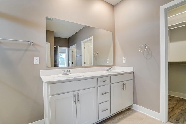 bathroom featuring tile patterned flooring and vanity