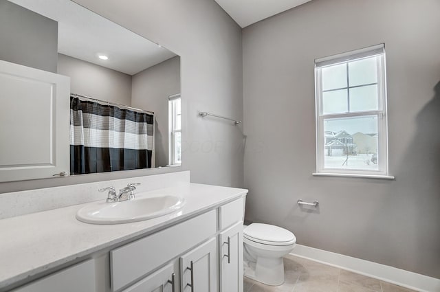 bathroom with a shower with shower curtain, tile patterned flooring, vanity, and toilet