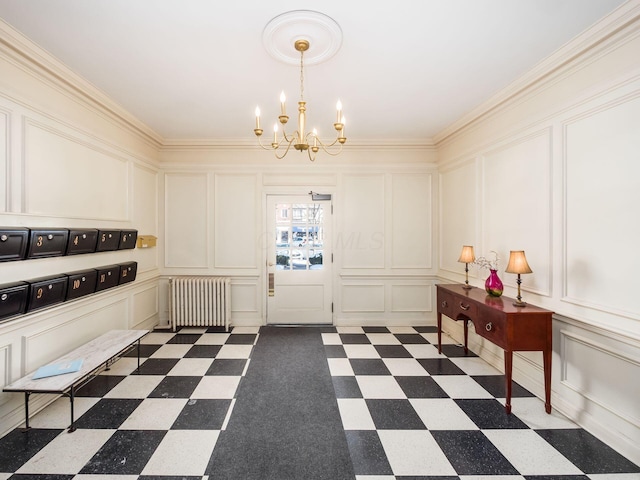 interior space featuring an inviting chandelier, ornamental molding, and radiator heating unit