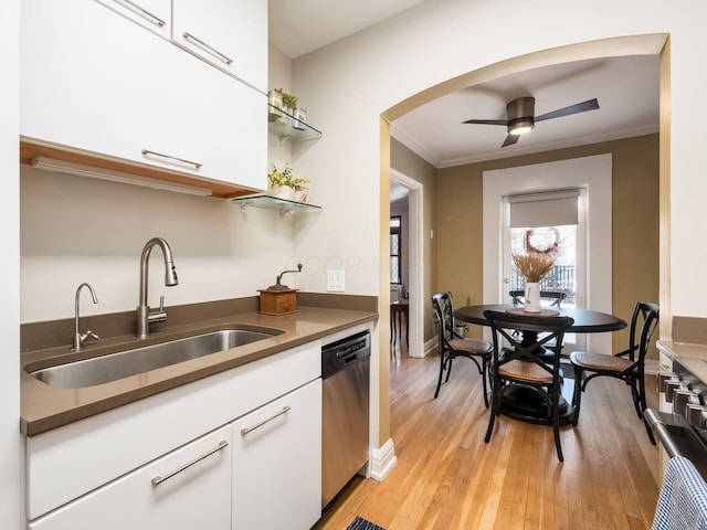 kitchen with dishwasher, sink, crown molding, and white cabinetry