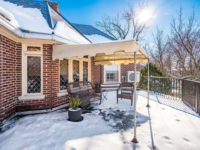 view of snow covered patio