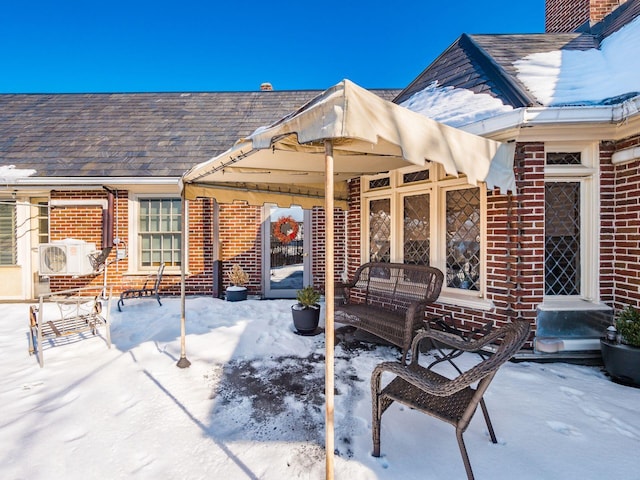 view of snow covered patio