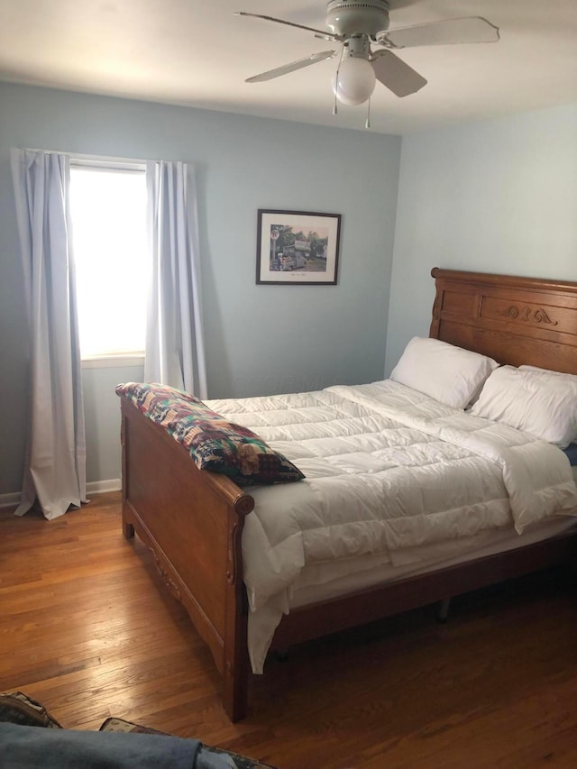 bedroom featuring ceiling fan and light hardwood / wood-style floors