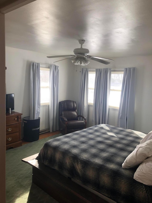 carpeted bedroom featuring ceiling fan