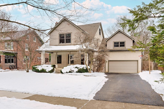 view of front of home featuring a garage and a porch