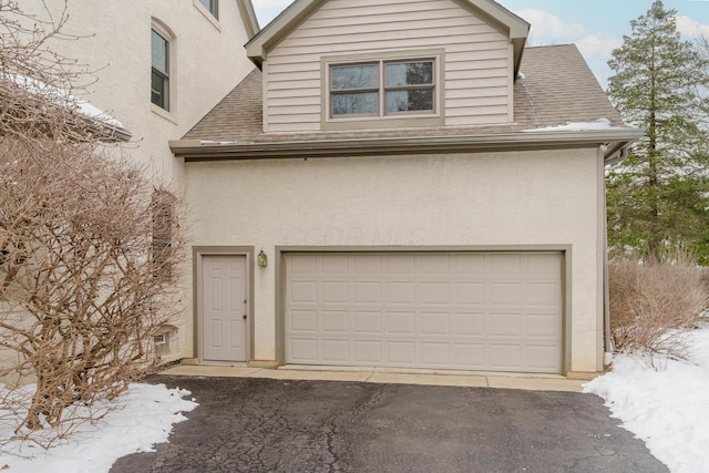 view of snow covered garage