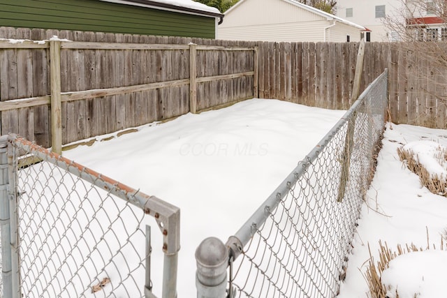 view of yard covered in snow