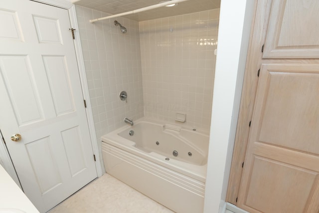 bathroom featuring tile patterned floors and tiled shower / bath