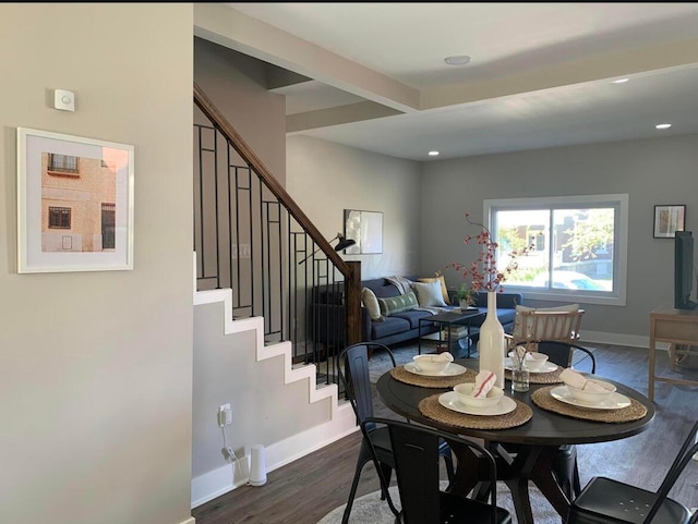 dining area with dark wood-type flooring